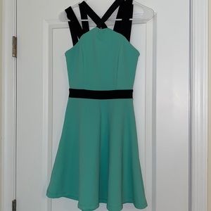 Charlotte Russe blue/green with black accents halter top skater dress. Size S.
